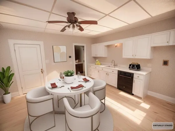 a view of a dining room with furniture a kitchen and chandelier