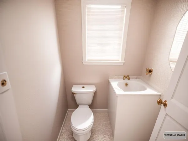 a white toilet sitting next to a white sink