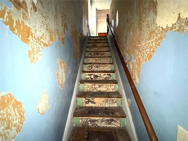 a bathroom with a shower and a mirror
