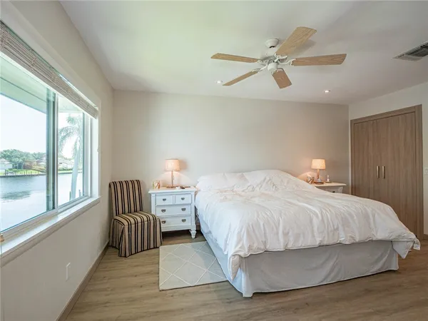 a bedroom with a bed and window