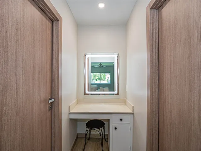 a view of an entryway with table and chair