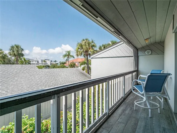 a view of balcony with furniture