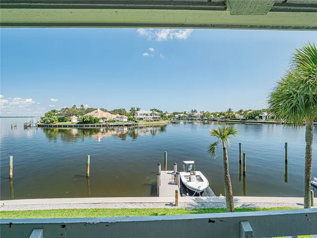 a small pool with trees in the background