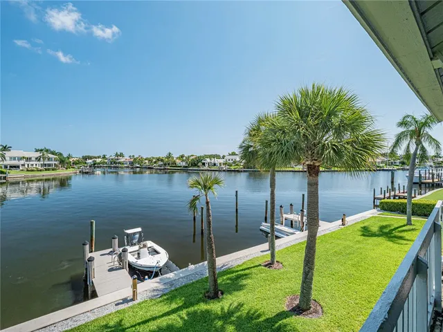 a view of a wooden deck and a lake view