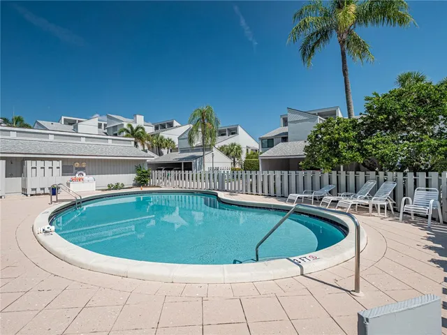 a view of swimming pool with seating space