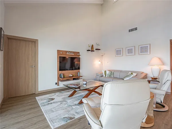 a living room with furniture and a table