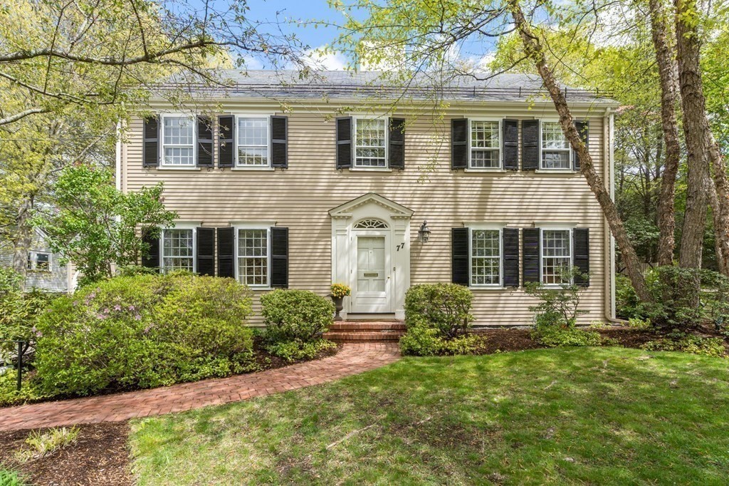 front view of a house with a yard