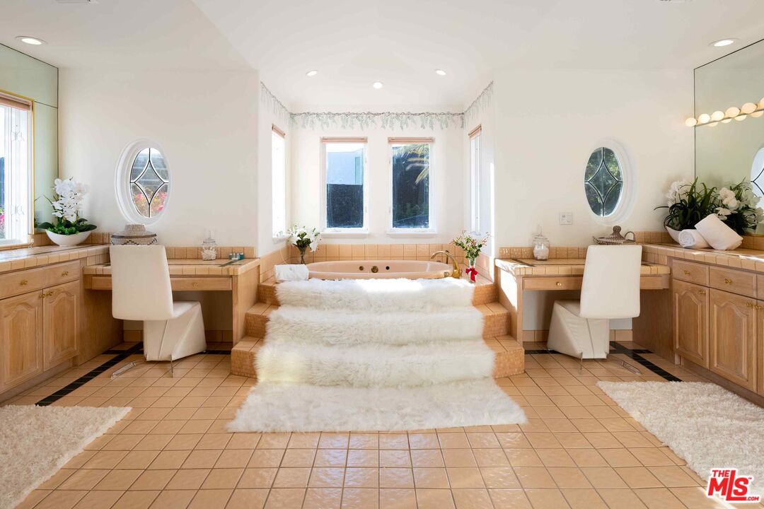 1100 Stradella Road Los Angeles, CA 90077 - Photo 17 of 26 a living room with a couch and chandelier