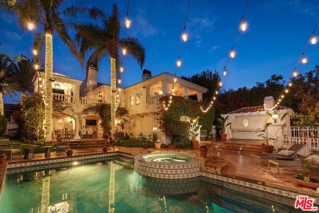 1100 Stradella Road Los Angeles, CA 90077 - Photo 23 of 26 a view of a swimming pool with outdoor seating