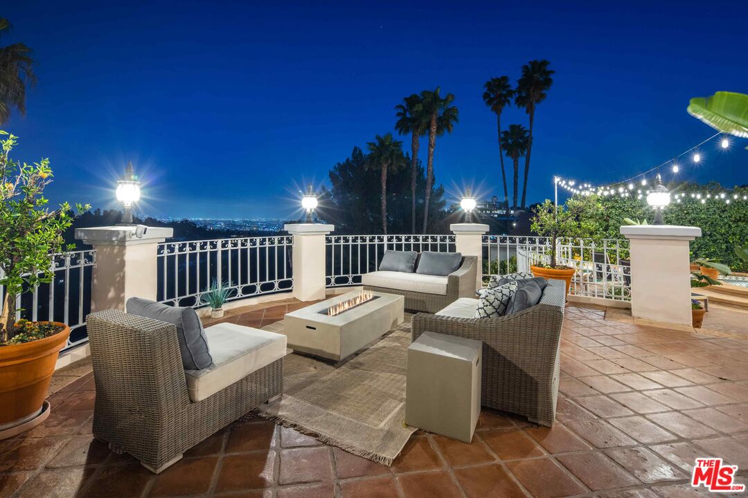 1100 Stradella Road Los Angeles, CA 90077 - Photo 24 of 26 a outdoor space with patio furniture and potted plants