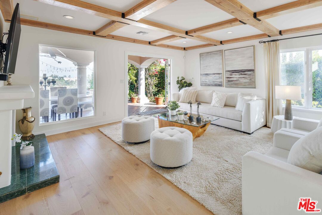 1100 Stradella Road Los Angeles, CA 90077 - Photo 6 of 26 a living room with furniture and a large window