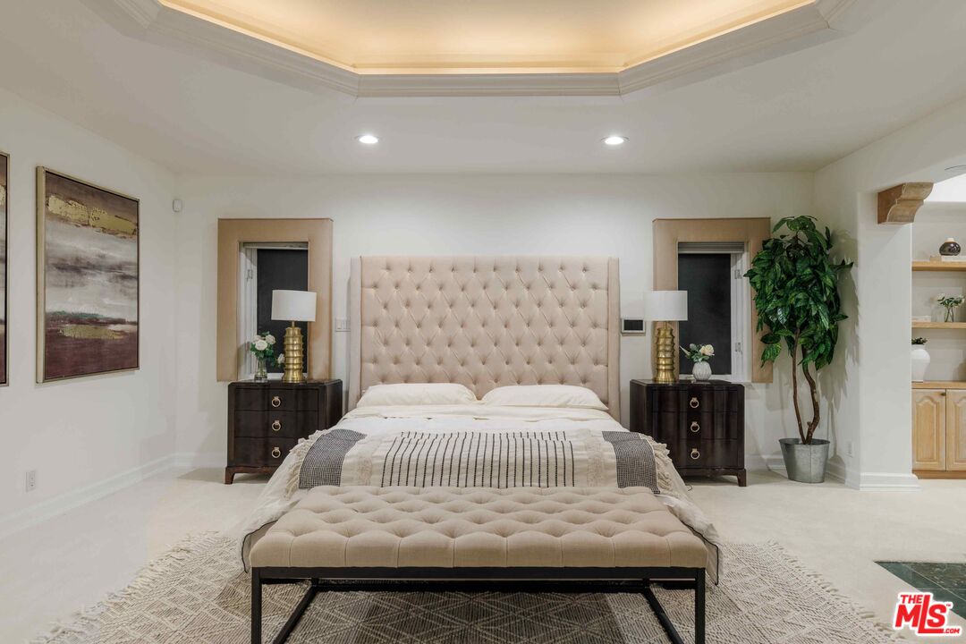 1100 Stradella Road Los Angeles, CA 90077 - Photo 7 of 26 a bedroom with a bed and a table in it