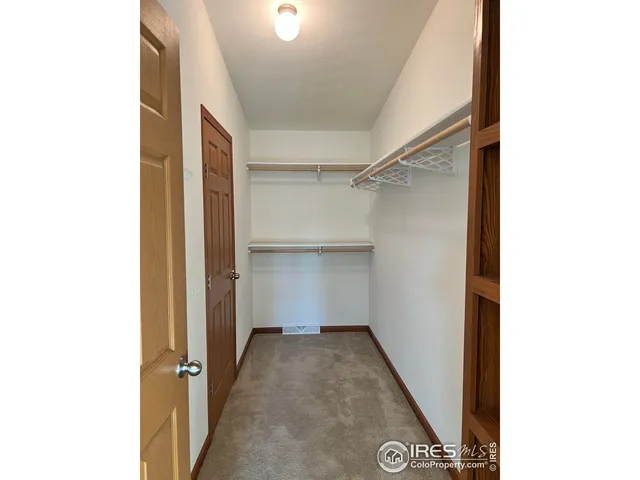 a view of a hallway with closet