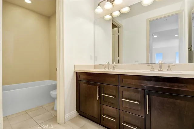 a bathroom with a sink a toilet and a bathtub