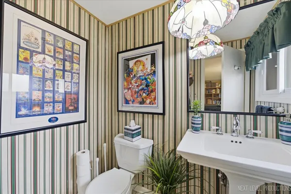 a bathroom with a sink a large mirror and a bathtub