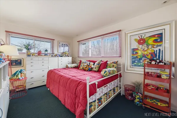 a bedroom with a bed and dresser