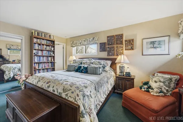 a bedroom with a bed and a couch