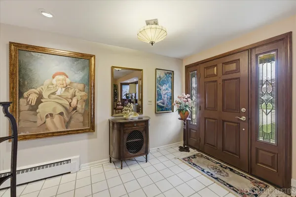 a view of a entryway with furniture and chandelier