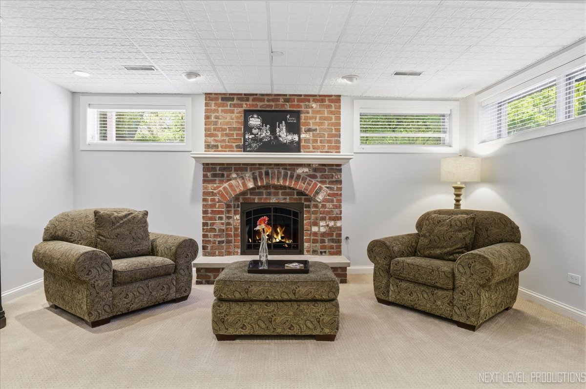 1914 North Ridge Avenue Arlington Heights, IL 60004 - Photo 32 of 50 a living room with furniture and a fireplace