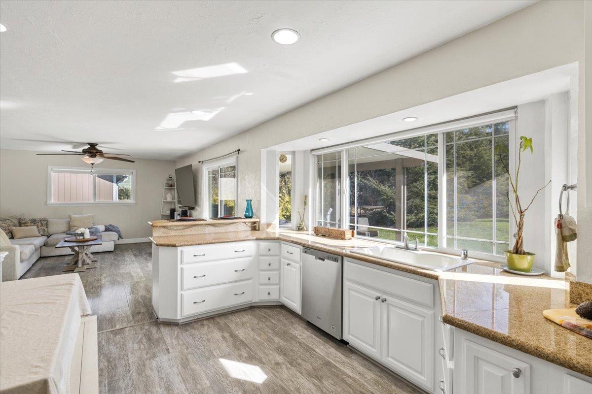 11195 Ringtail Road Penn Valley, CA 95946 - Photo 16 of 47 a large white kitchen with a large window