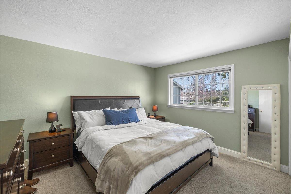 11195 Ringtail Road Penn Valley, CA 95946 - Photo 18 of 47 a bedroom with a bed and painting on the wall