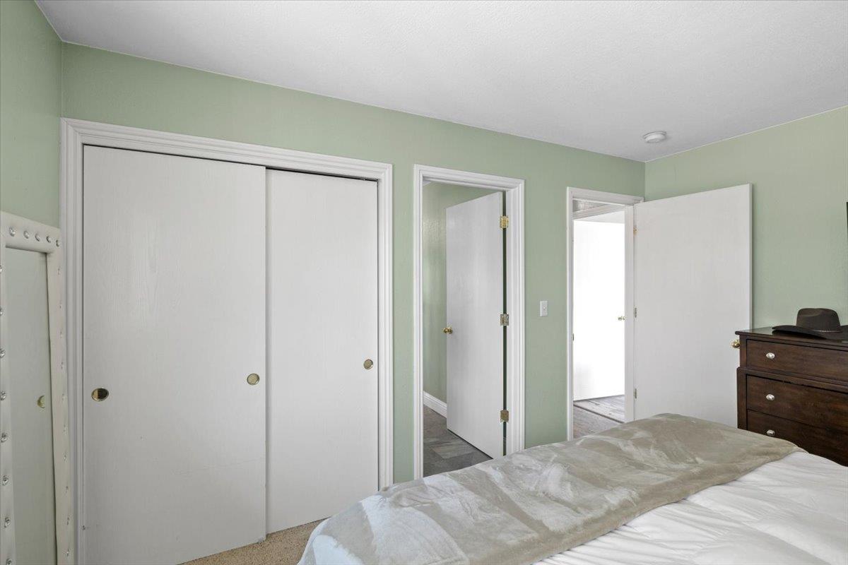 11195 Ringtail Road Penn Valley, CA 95946 - Photo 19 of 47 a bedroom with a bed and a dresser