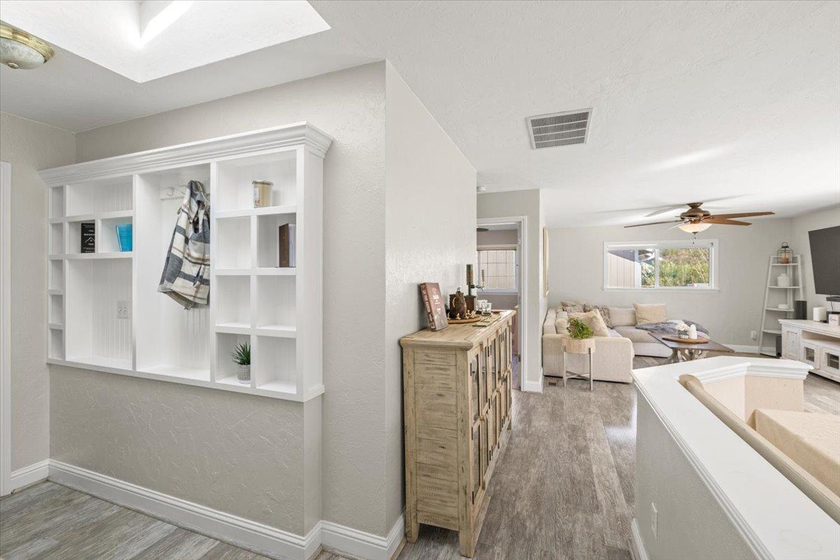 11195 Ringtail Road Penn Valley, CA 95946 - Photo 24 of 47 a living room with furniture a wooden floor and a large window
