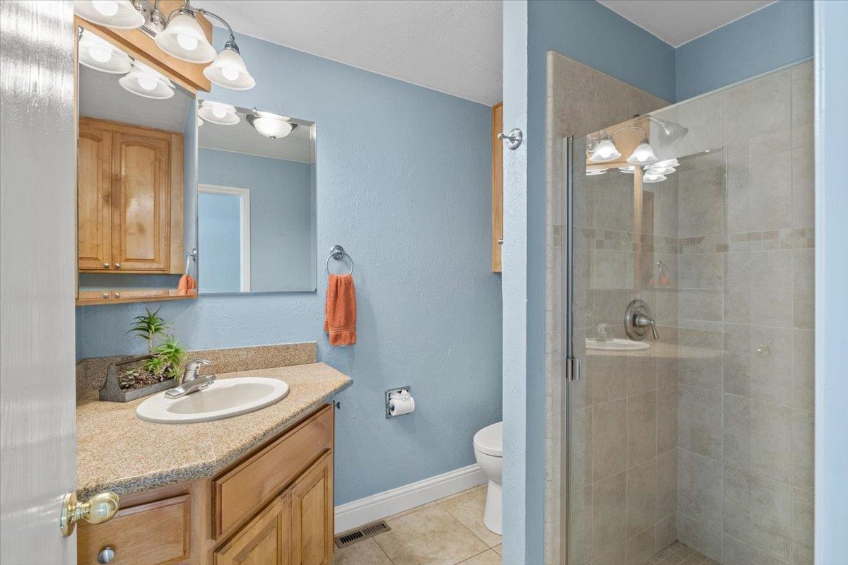 11195 Ringtail Road Penn Valley, CA 95946 - Photo 26 of 47 a bathroom with a sink toilet and shower