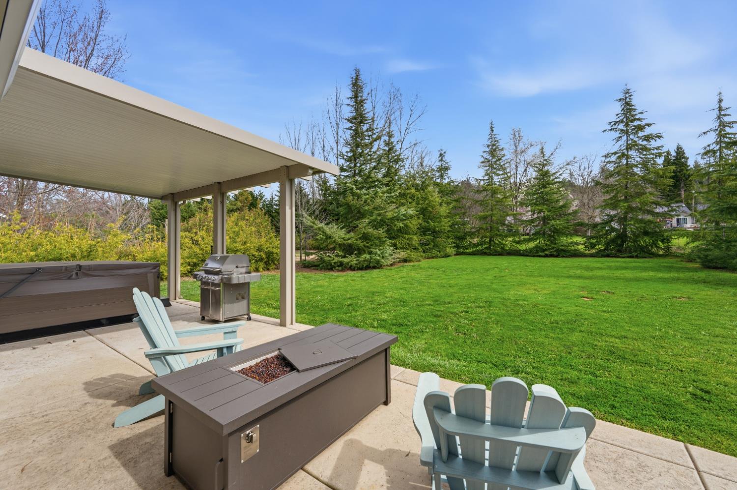 11195 Ringtail Road Penn Valley, CA 95946 - Photo 43 of 47 a view of a patio with a table chairs and a backyard