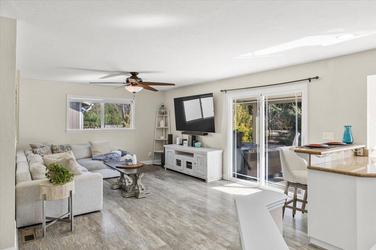 11195 Ringtail Road Penn Valley, CA 95946 - Photo 9 of 47 a living room with furniture and a flat screen tv