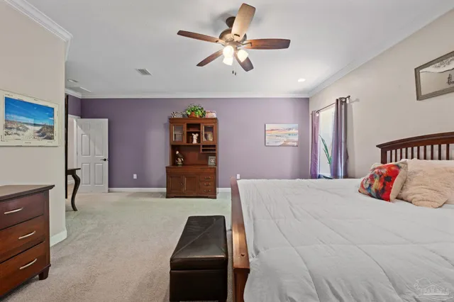 a bedroom with a bed and dresser