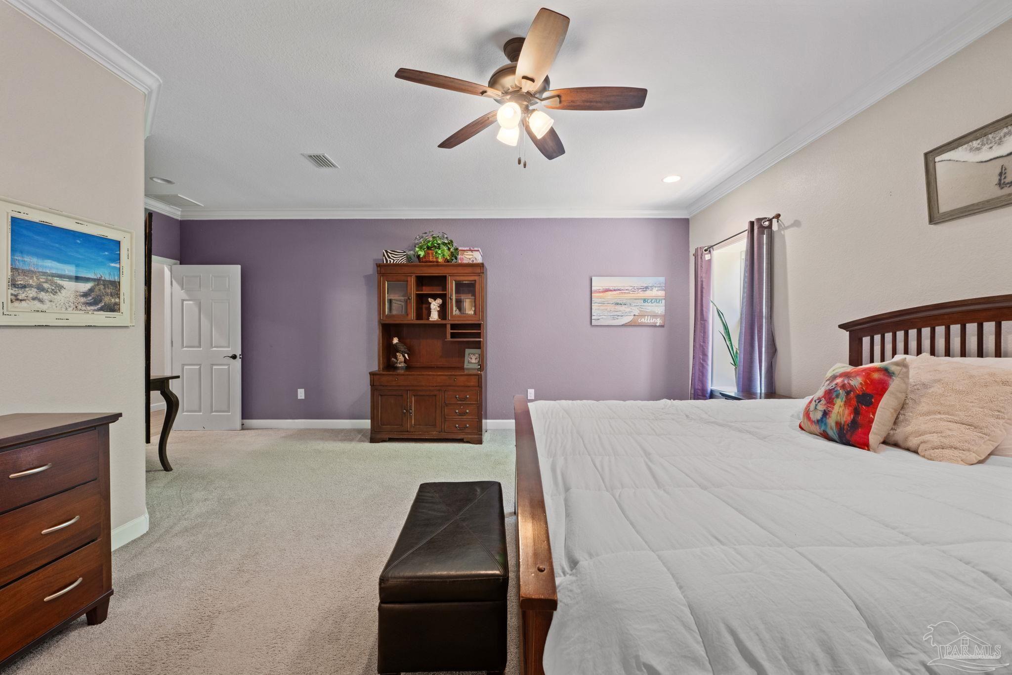 6781 Generals Lane Pace, FL 32571 - Photo 14 of 35 a bedroom with a bed and dresser