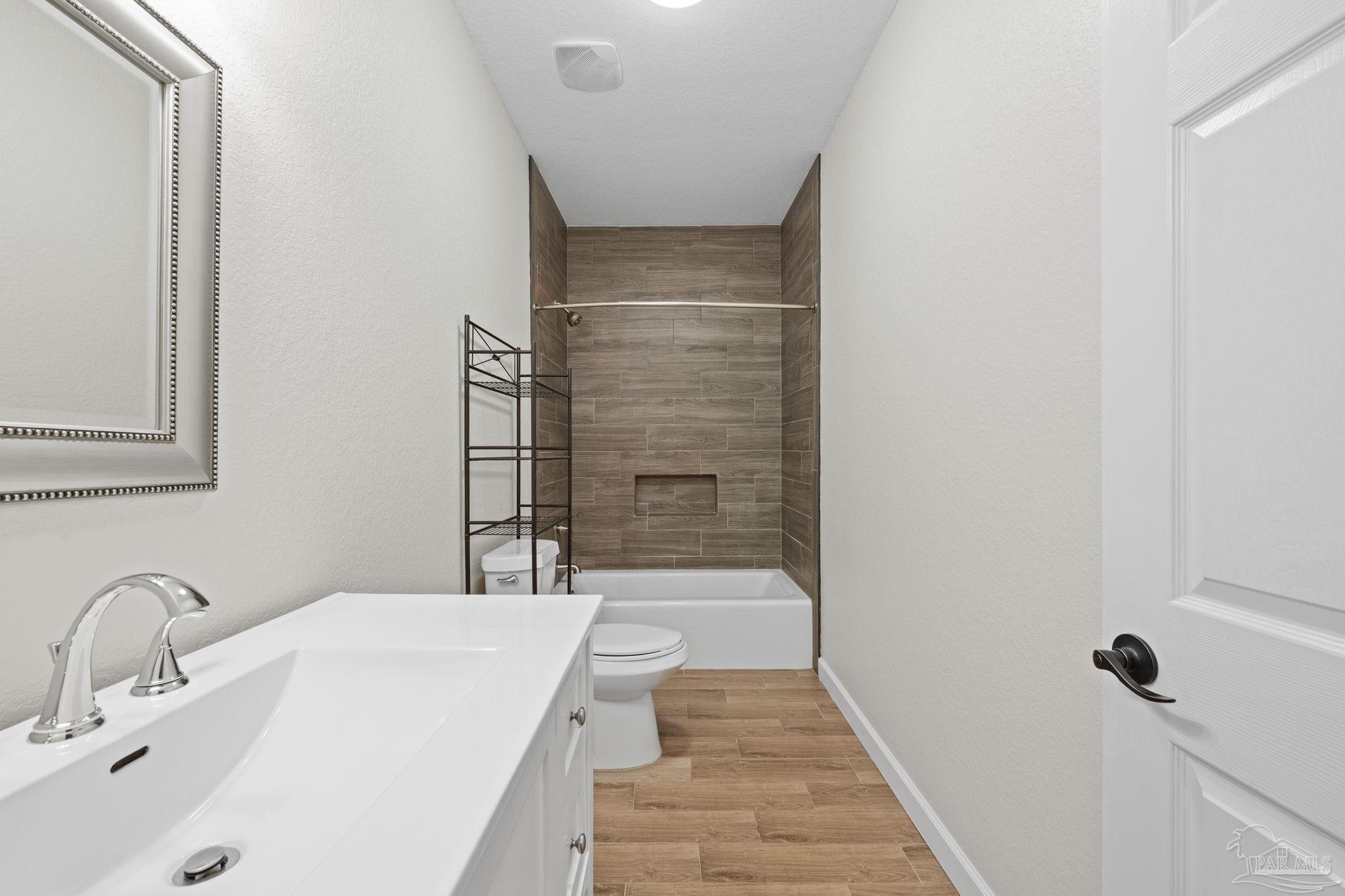 6781 Generals Lane Pace, FL 32571 - Photo 20 of 35 a bathroom with a sink and a shower