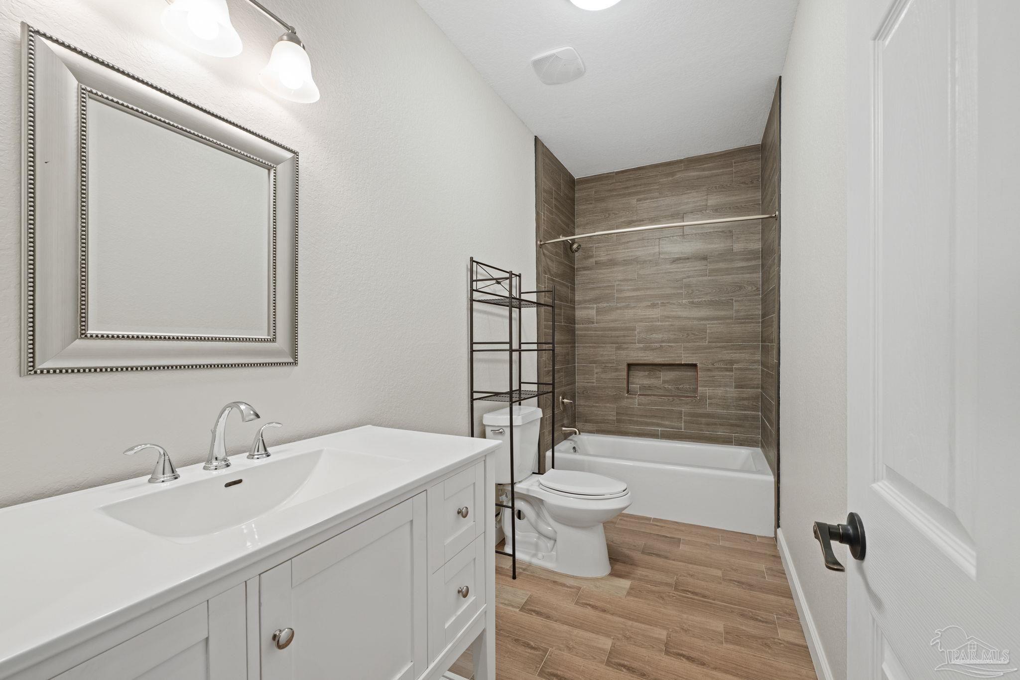 6781 Generals Lane Pace, FL 32571 - Photo 21 of 35 a bathroom with a sink toilet and shower