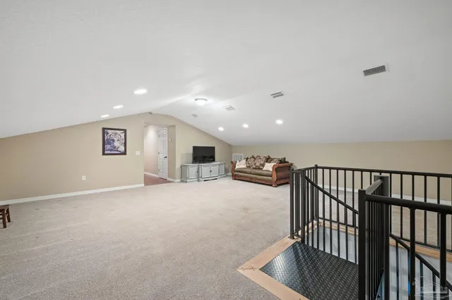 a view of livingroom with furniture and workspace