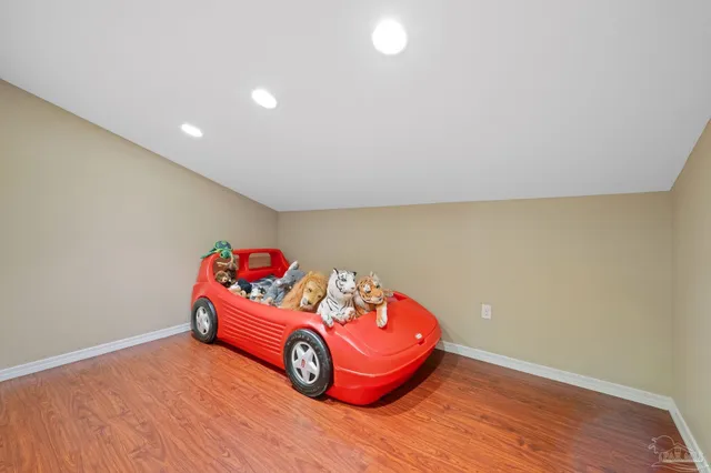 a room with a wooden floor and a table