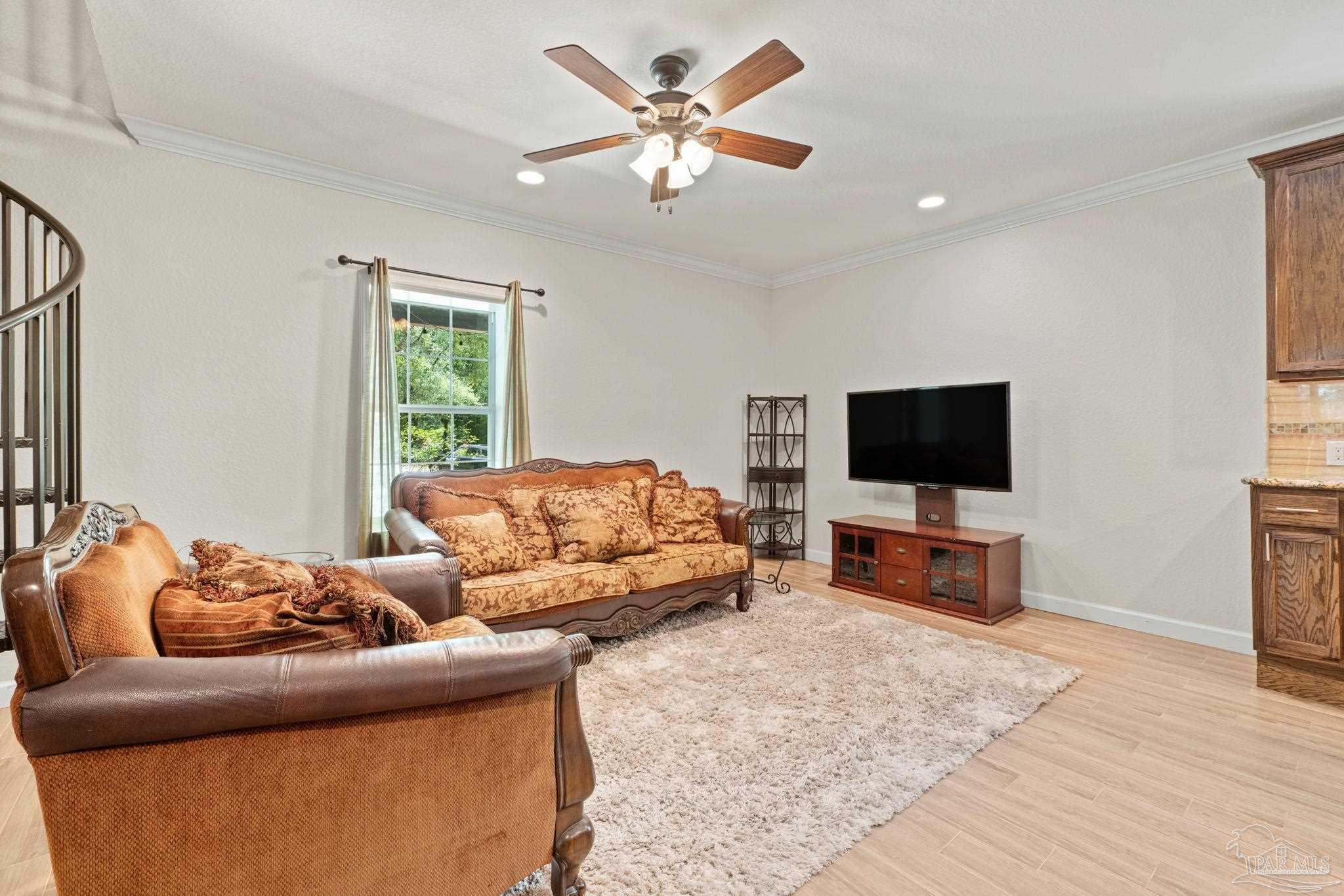 6781 Generals Lane Pace, FL 32571 - Photo 4 of 35 a living room with furniture and a flat screen tv