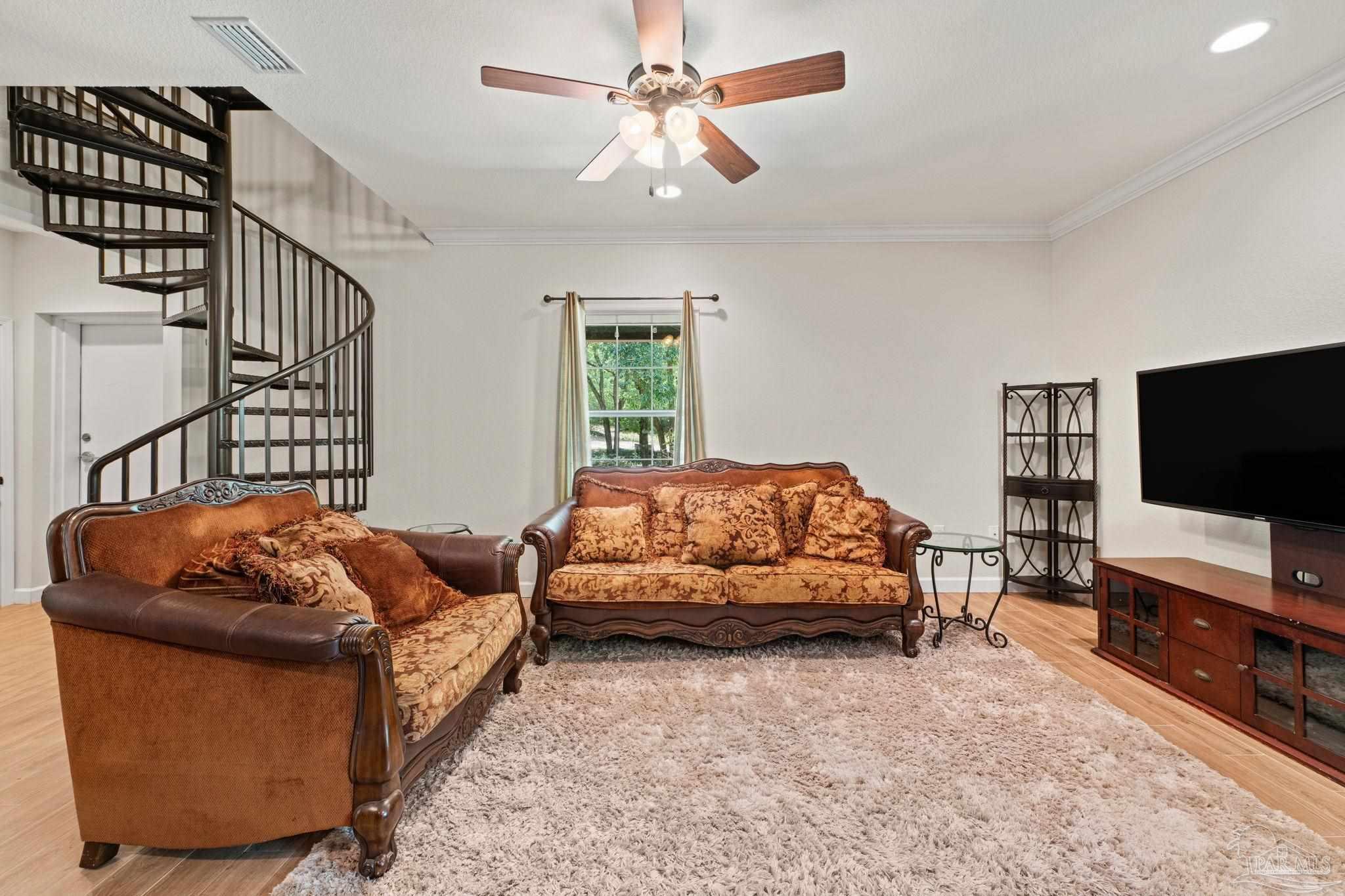 6781 Generals Lane Pace, FL 32571 - Photo 5 of 35 a living room with furniture and a flat screen tv