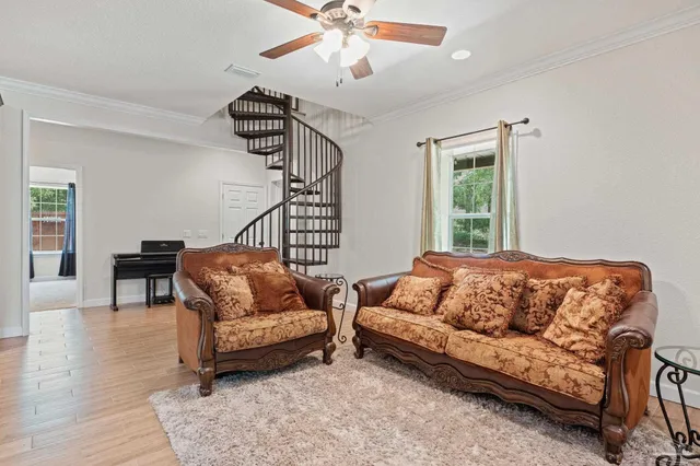 a living room with furniture and a window