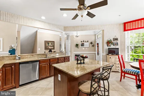 a kitchen with a dining table and chairs