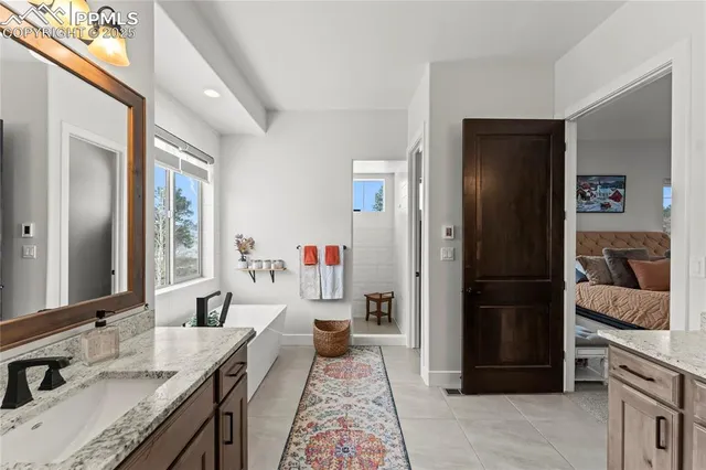 a kitchen with a refrigerator and a sink