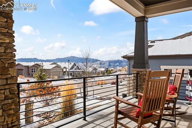 a view of a balcony with furniture