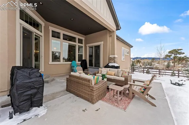 a view of a house with a snow in the background