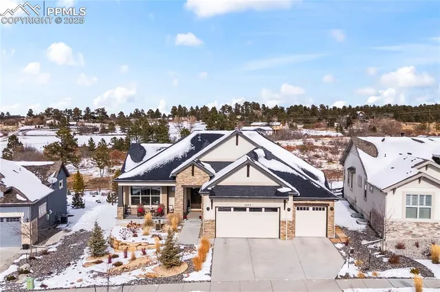 an aerial view of residential house and sandy dunes