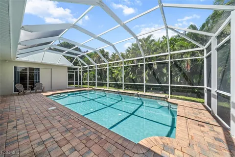 a view of a chairs and table in a patio