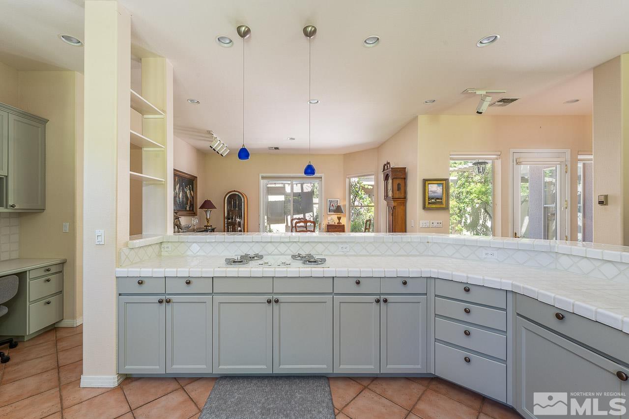 4440 Juniper Trail Reno, NV 89519 - Photo 12 of 29 a bathroom with a granite countertop sink mirror and window
