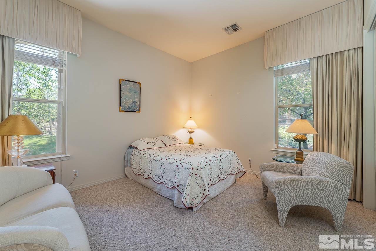 4440 Juniper Trail Reno, NV 89519 - Photo 19 of 29 a living room with furniture a window and a lamp