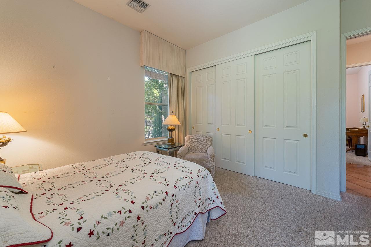 4440 Juniper Trail Reno, NV 89519 - Photo 20 of 29 a bedroom with a bed and a window