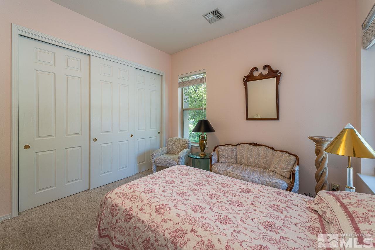4440 Juniper Trail Reno, NV 89519 - Photo 21 of 29 a bedroom with a bed and a closet