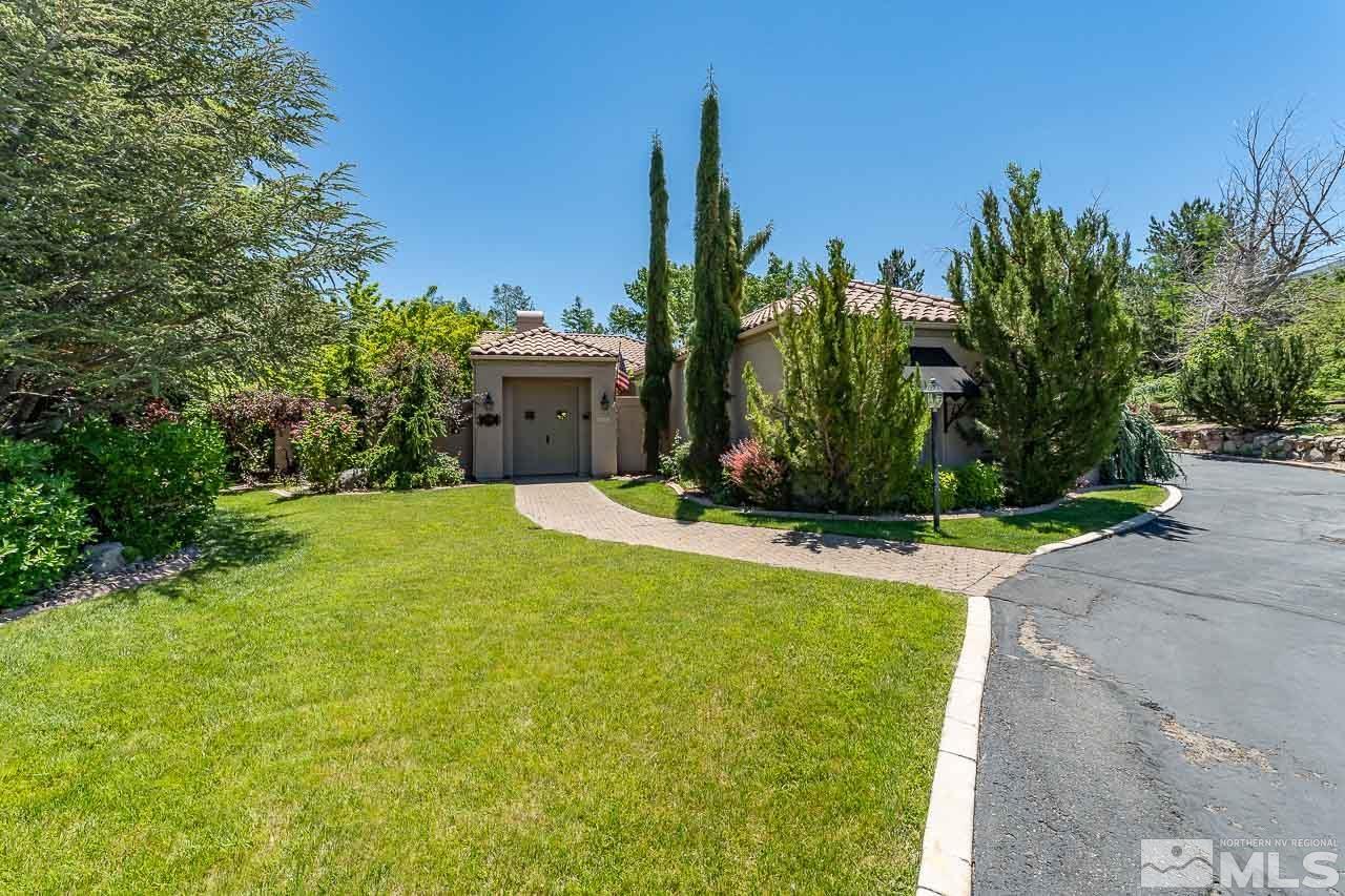4440 Juniper Trail Reno, NV 89519 - Photo 3 of 29 a view of a garden with a building in the background